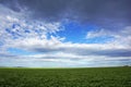 Field against sky, agriculture and farming land with sky and clouds in Victoria, Australia.