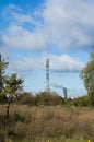 Field in autumn and industrial chimney Royalty Free Stock Photo