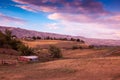 Field and Barn with Pink Clouds and Blue Sky Royalty Free Stock Photo