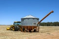 A field bin being towed by a tractor on a farm in Australia.