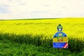 Field blooming rape sign Repsol