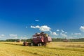 Field combine harvester elevator to upload cereal into tractor Royalty Free Stock Photo