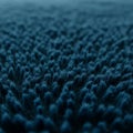 A field of densely packed, dark blue, grass-like elements creates a textured, wave-like Royalty Free Stock Photo