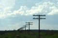 Field with electrity pillars Royalty Free Stock Photo