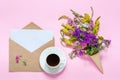 Field flowers, craft envelope and cup of coffee Royalty Free Stock Photo