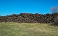 Field with giant pile of railway cross ties Royalty Free Stock Photo