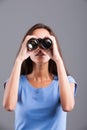 Field glasses hold by a slim woman Royalty Free Stock Photo