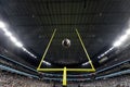 Field Goal Posts in a large indoor football stadium during a game. Royalty Free Stock Photo