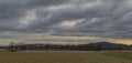 Field and hills near Hreben pond village in cloudy day in south Bohemia