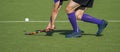 Field Hockey player, forcefully passing the ball Royalty Free Stock Photo