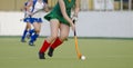 Field Hockey player, ready to pass the ball to a team mate Royalty Free Stock Photo