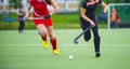 Field Hockey player, ready to pass the ball to a team mate Royalty Free Stock Photo