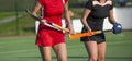 Field Hockey player, ready to pass the ball to a team mate Royalty Free Stock Photo