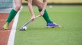 Field Hockey player, ready to pass the ball to a team mate. Hockey is a team game Royalty Free Stock Photo