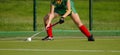 Field Hockey player, ready to pass the ball to a team mate Royalty Free Stock Photo