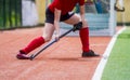 Field Hockey player, ready to pass the ball to a team mate. Hockey is a team game Royalty Free Stock Photo