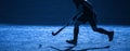 A Field Hockey Player About To Pass The Ball. Blue filter Royalty Free Stock Photo