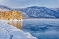 Field of ice hummocks and rock on the frozen Lake Baikal. Sunrise Royalty Free Stock Photo