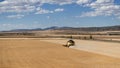 a field machine working a cereal field