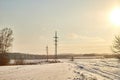 Field, meadow and grass with snow and cold sun on foggy cloudy sky. Beautiful winter landscape. Winter morning, day or Royalty Free Stock Photo