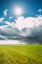 Field Or Meadow Landscape With Green Grass Under Scenic Spring Blue Dramatic Royalty Free Stock Photo