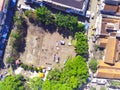 A FIELD IN THE MIDDLE OF URBAN AREA - STOCK PHOTO