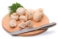 Field mushrooms on a cutting board and knife Royalty Free Stock Photo