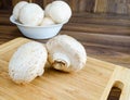 Field mushrooms on a cutting board Royalty Free Stock Photo