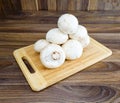 Field mushrooms on a cutting board Royalty Free Stock Photo