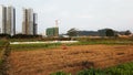 Field nearby the construction sites concept of balance of agriculture & modernize