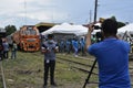 Field news reporter and vlogger working on their gears during the arrival of President Rodrigo R. Duterte to inaugurate the openin