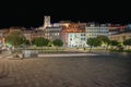 field of onions at night with facade of Casa dos Becos and SÃÂ© in Lisbon.