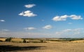 Field plowed after harvesting. Summer landscape with blue sky Royalty Free Stock Photo
