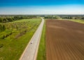 Spring arable land. A field and road. View from above. Royalty Free Stock Photo