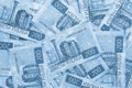 Field of Russian banknotes of 200 rubles. Light blue tinted wallpaper or background. Economy, finance or banks. Bills depict the