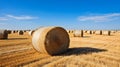 A Field Scattered with Freshly Made Straw Bales and Clear Blue Sky. Generative Ai Royalty Free Stock Photo