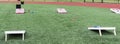 Field set up with cornhole boards for gym classes