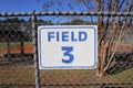 Field 3 sign on chain link fence closeup Royalty Free Stock Photo
