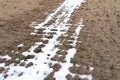 Field for sowing agricultural crops. It\'s snowing early. Snow and ice lies in the field. Royalty Free Stock Photo