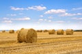 A field with straw bales after harvest