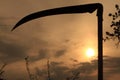 Field sunset and scythe Royalty Free Stock Photo