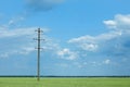 Field with telephone pole under sky Royalty Free Stock Photo