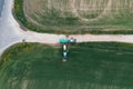 Field treatment with herbicides. A tractor with a sprayer drives up to the gas station to the tractor with a water tank Royalty Free Stock Photo