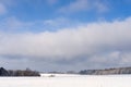 Field under snow by forest near Kostelec nad Cernymi Lesy