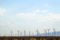 Field of windmills along the desert landscape