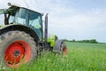 Field work tractor in meadow