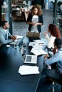 Fielding questions. High angle shot of an attractive young businesswoman addressing her colleagues during a meeting in Royalty Free Stock Photo