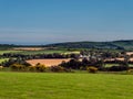 fields and hills in the evening in Ireland. Irish rural landscape, agricultural land. Green grass field near green trees Royalty Free Stock Photo