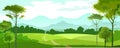 Fields, meadows and pastures. Rural landscape. Road through the hills. Graceful young trees. In the distance the mountain horizon. Royalty Free Stock Photo