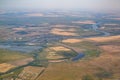 Fields, meadows, swamps, a river and several villages shown from from a birds eye view